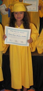 Monica received her diploma for graduating kindergarten 