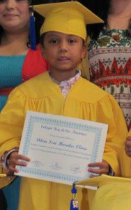 Dilan receiving his diploma for kindergarten